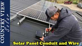 Installing Conduit and Wire to Roof Mounted Solar Panels