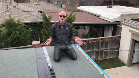 Denver Roofer install peel and stick or self adhered modified roof. Patio flat roof.